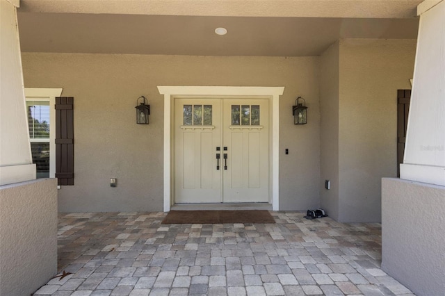 12090 Thames Ave, Weeki Wachee, FL 34614 - property entrance with stucco siding