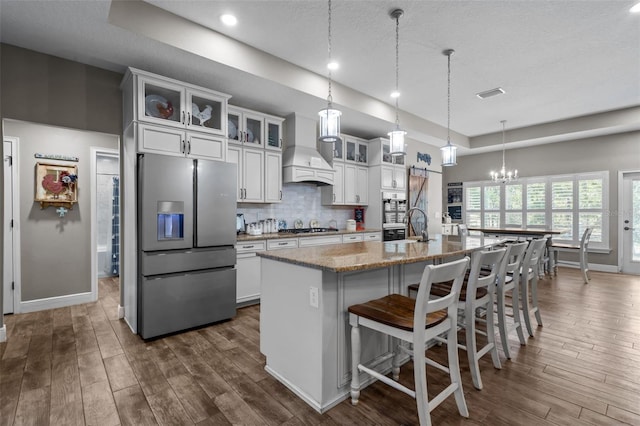 12090 Thames Ave, Weeki Wachee, FL 34614 - kitchen featuring stainless steel appliances, custom range hood, dark wood-type flooring, and recessed lighting