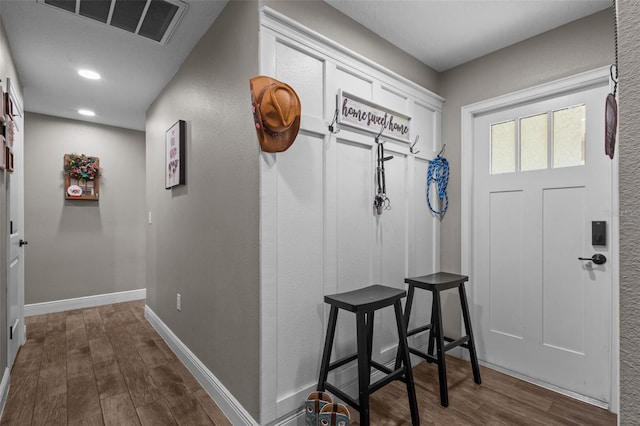 12090 Thames Ave, Weeki Wachee, FL 34614 - foyer entrance with dark wood-type flooring, baseboards, and recessed lighting