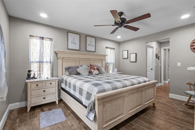 12090 Thames Ave, Weeki Wachee, FL 34614 - bedroom with baseboards, dark wood-type flooring, ceiling fan, and recessed lighting