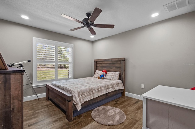 12090 Thames Ave, Weeki Wachee, FL 34614 - bedroom featuring wood finished floors, baseboards, recessed lighting, and a ceiling fan