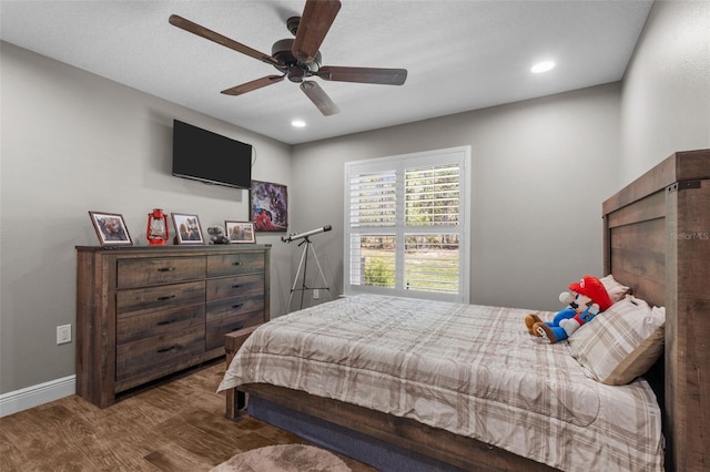 12090 Thames Ave, Weeki Wachee, FL 34614 - bedroom with wood finished floors, baseboards, recessed lighting, and a ceiling fan