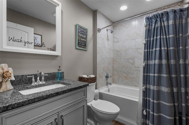 12090 Thames Ave, Weeki Wachee, FL 34614 - full bathroom with vanity, toilet, and shower / bath combination with curtain