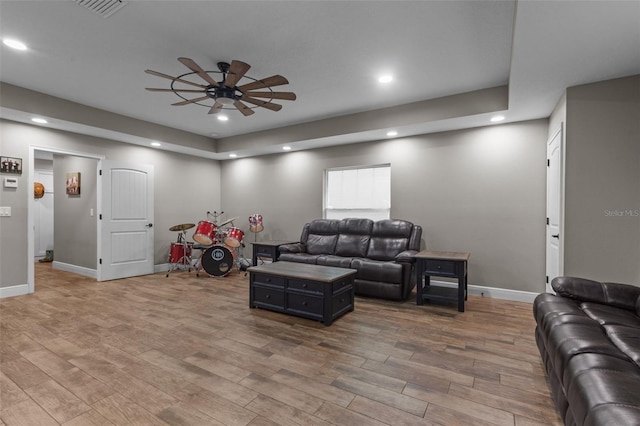 12090 Thames Ave, Weeki Wachee, FL 34614 - living area featuring a ceiling fan, recessed lighting, baseboards, and wood finished floors