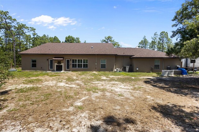 12090 Thames Ave, Weeki Wachee, FL 34614 - rear view of property featuring stucco siding