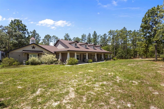 12090 Thames Ave, Weeki Wachee, FL 34614 - view of front of house with a front lawn and a porch
