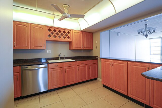7400 Sun Island Dr S Unit 501, South Pasadena, FL 33707 - kitchen with stainless steel dishwasher, a sink, a ceiling fan, light tile patterned floors, and a chandelier