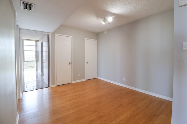 7400 Sun Island Dr S Unit 501, South Pasadena, FL 33707 - empty room featuring light wood finished floors and baseboards