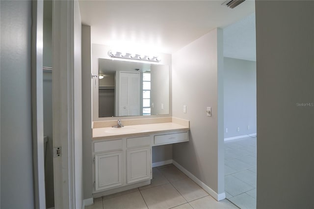 7400 Sun Island Dr S Unit 501, South Pasadena, FL 33707 - bathroom featuring tile patterned floors, vanity, and baseboards