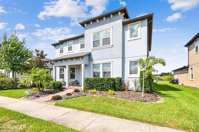 17589 Cruiser Bnd, Land O Lakes, FL 34638 - view of front of property featuring stucco siding and a front yard