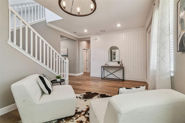 17589 Cruiser Bnd, Land O Lakes, FL 34638 - living area featuring ornamental molding, stairway, baseboards, wood finished floors, and recessed lighting
