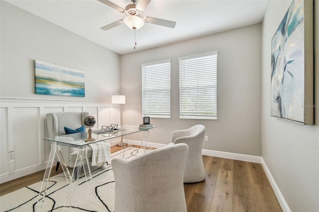 17589 Cruiser Bnd, Land O Lakes, FL 34638 - home office featuring wood finished floors, a ceiling fan, and baseboards