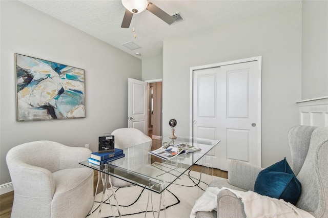 17589 Cruiser Bnd, Land O Lakes, FL 34638 - office area with wood finished floors, ceiling fan, and baseboards