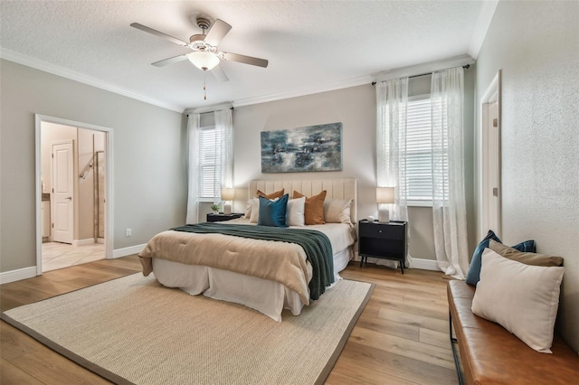 17589 Cruiser Bnd, Land O Lakes, FL 34638 - bedroom with crown molding, multiple windows, light wood-style flooring, a textured ceiling, and a ceiling fan