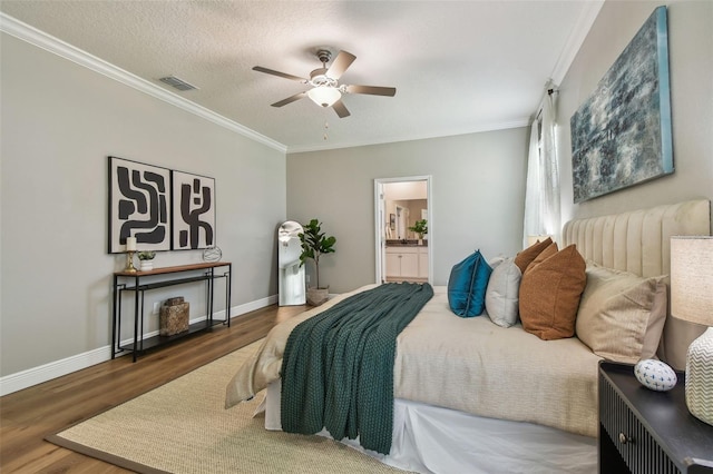 17589 Cruiser Bnd, Land O Lakes, FL 34638 - bedroom featuring wood finished floors, ornamental molding, baseboards, connected bathroom, and ceiling fan