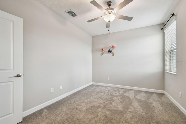 17589 Cruiser Bnd, Land O Lakes, FL 34638 - empty room featuring carpet flooring, ceiling fan, baseboards, and a textured ceiling