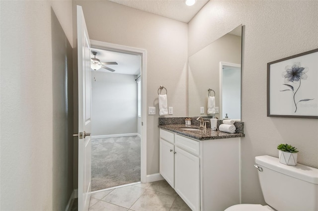 17589 Cruiser Bnd, Land O Lakes, FL 34638 - half bathroom with vanity, toilet, tile patterned floors, and baseboards