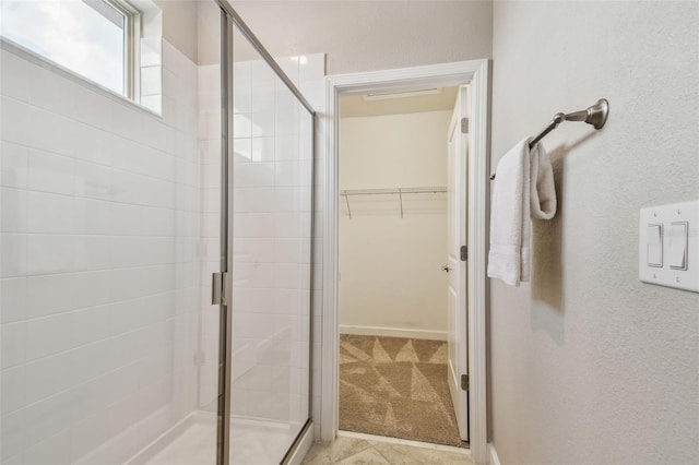17589 Cruiser Bnd, Land O Lakes, FL 34638 - full bathroom with a stall shower and a walk in closet