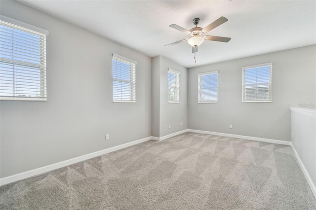 17589 Cruiser Bnd, Land O Lakes, FL 34638 - spare room featuring a ceiling fan, light colored carpet, and baseboards