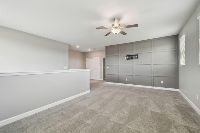 17589 Cruiser Bnd, Land O Lakes, FL 34638 - unfurnished room featuring a ceiling fan, light colored carpet, a decorative wall, baseboards, and recessed lighting