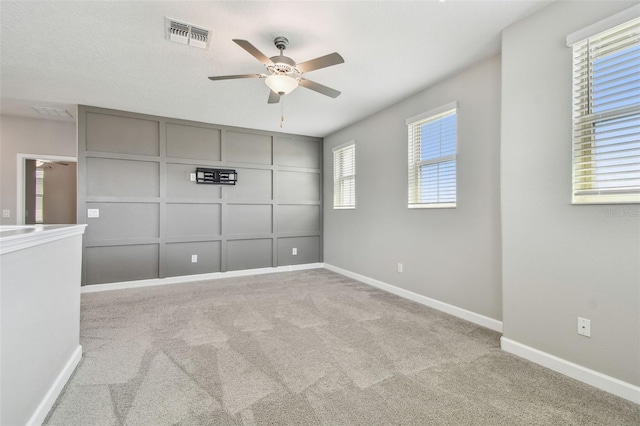 17589 Cruiser Bnd, Land O Lakes, FL 34638 - unfurnished bedroom with carpet, baseboards, and a ceiling fan