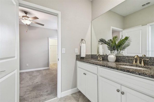 17589 Cruiser Bnd, Land O Lakes, FL 34638 - bathroom featuring double vanity, a ceiling fan, baseboards, and vaulted ceiling