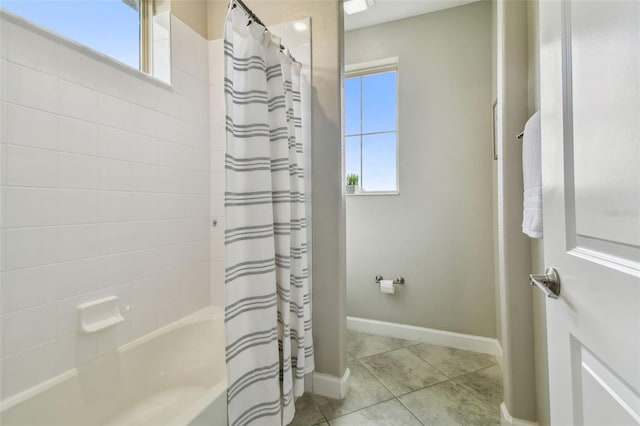 17589 Cruiser Bnd, Land O Lakes, FL 34638 - full bath with shower / tub combo, tile patterned flooring, and baseboards