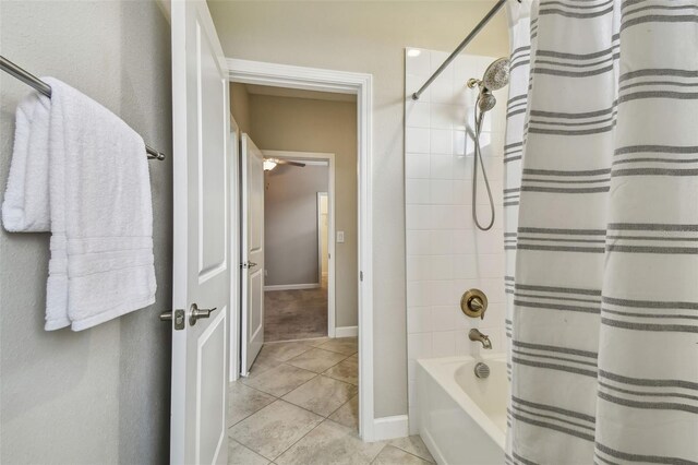17589 Cruiser Bnd, Land O Lakes, FL 34638 - full bath with tile patterned flooring, baseboards, and shower / tub combo with curtain