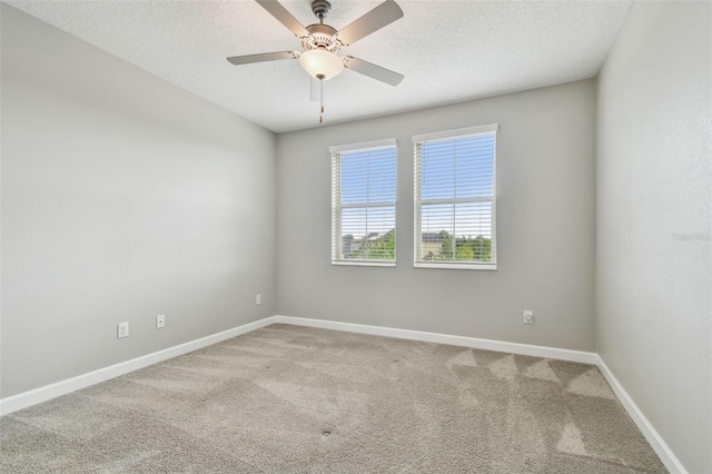 17589 Cruiser Bnd, Land O Lakes, FL 34638 - carpeted spare room with baseboards, a textured ceiling, and a ceiling fan