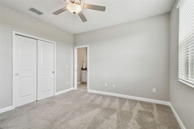 17589 Cruiser Bnd, Land O Lakes, FL 34638 - unfurnished bedroom with carpet flooring, a closet, baseboards, and ceiling fan
