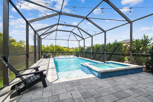 17589 Cruiser Bnd, Land O Lakes, FL 34638 - view of swimming pool featuring a pool with connected hot tub, a patio area, and a lanai
