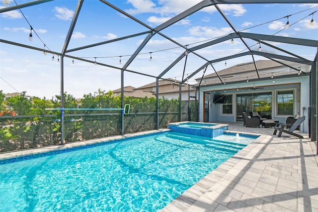 17589 Cruiser Bnd, Land O Lakes, FL 34638 - view of swimming pool with a patio area, ceiling fan, a pool with connected hot tub, and glass enclosure