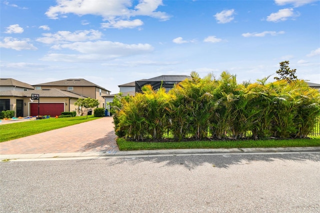 17589 Cruiser Bnd, Land O Lakes, FL 34638 - obstructed view of property featuring decorative driveway