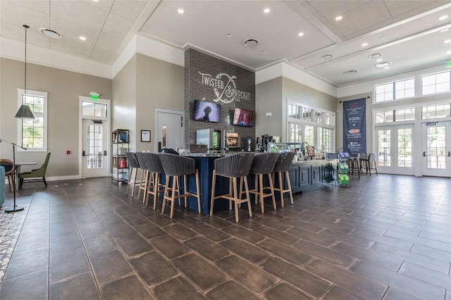 17589 Cruiser Bnd, Land O Lakes, FL 34638 - bar featuring a high ceiling, hanging light fixtures, recessed lighting, and baseboards