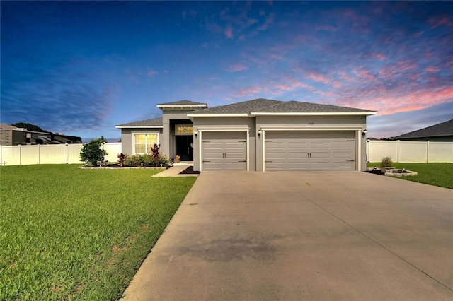 4435 Devinshire Fields Loop, Plant City, FL 33567 - prairie-style house with a garage, driveway, and stucco siding