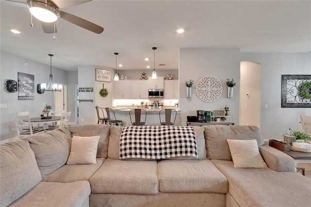 4435 Devinshire Fields Loop, Plant City, FL 33567 - living area with a ceiling fan, a chandelier, recessed lighting, and arched walkways