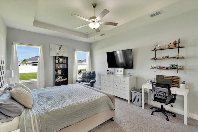 4435 Devinshire Fields Loop, Plant City, FL 33567 - carpeted bedroom with a tray ceiling, a ceiling fan, baseboards, and an office area
