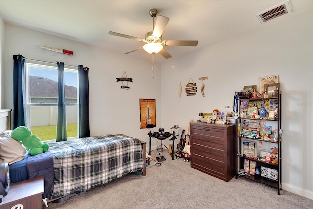 4435 Devinshire Fields Loop, Plant City, FL 33567 - bedroom with light carpet and a ceiling fan