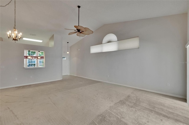 2527 Wrencrest Cir, Valrico, FL 33594 - spare room featuring vaulted ceiling, a ceiling fan, a chandelier, carpet flooring, and baseboards