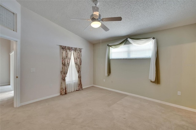 2527 Wrencrest Cir, Valrico, FL 33594 - empty room featuring a textured ceiling, light colored carpet, ceiling fan, lofted ceiling, and baseboards