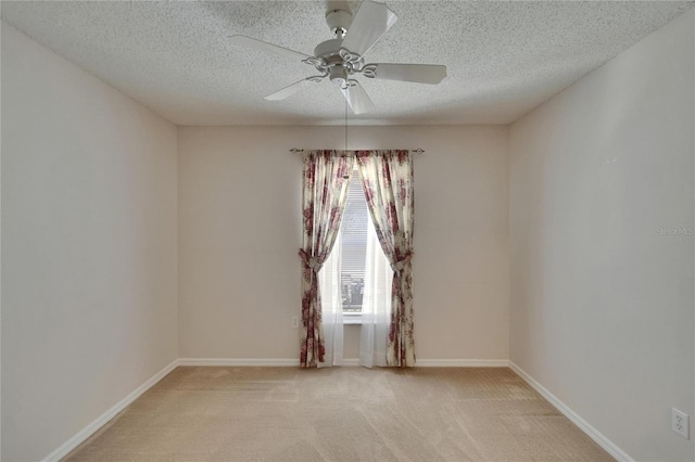 2527 Wrencrest Cir, Valrico, FL 33594 - spare room with a ceiling fan, a textured ceiling, light carpet, and baseboards