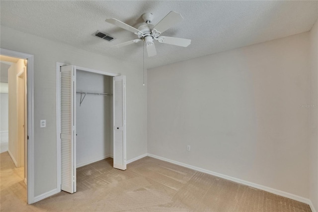 2527 Wrencrest Cir, Valrico, FL 33594 - unfurnished bedroom with light colored carpet, a closet, baseboards, ceiling fan, and a textured ceiling
