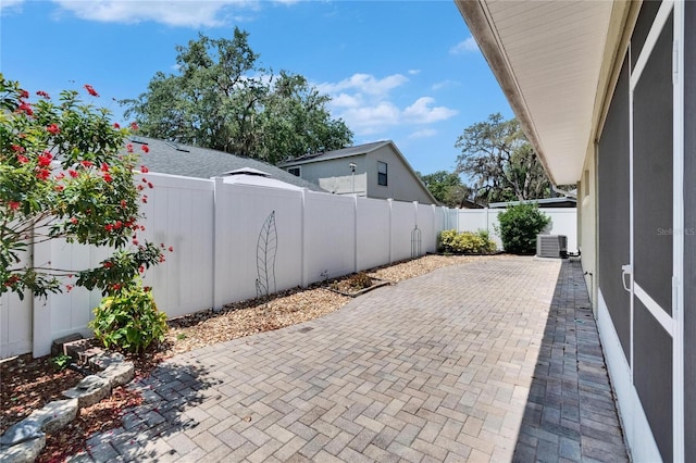 2527 Wrencrest Cir, Valrico, FL 33594 - fenced backyard featuring a patio area and central AC unit