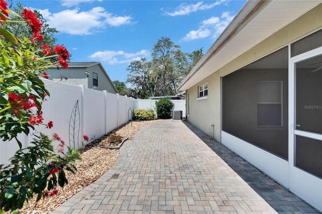 2527 Wrencrest Cir, Valrico, FL 33594 - fenced backyard with a patio and central air condition unit