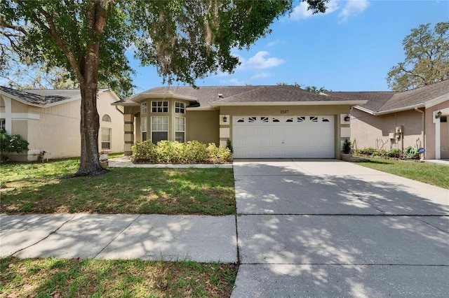 2527 Wrencrest Cir, Valrico, FL 33594 - single story home featuring an attached garage, stucco siding, concrete driveway, and a front lawn
