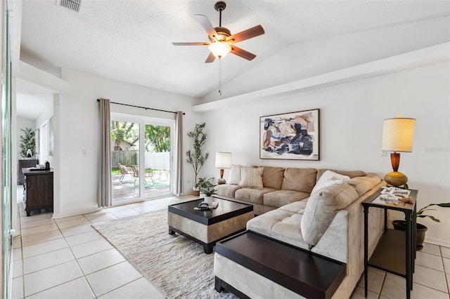 11510 92nd Way, Largo, FL 33773 - living room featuring vaulted ceiling, light tile patterned floors, ceiling fan, and a textured ceiling