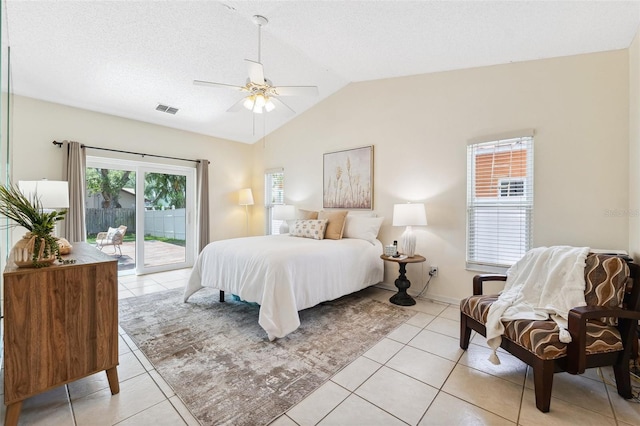 11510 92nd Way, Largo, FL 33773 - bedroom featuring access to exterior, light tile patterned flooring, vaulted ceiling, ceiling fan, and a textured ceiling