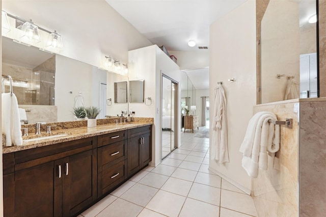11510 92nd Way, Largo, FL 33773 - bathroom with double vanity, tile patterned flooring, and a tile shower