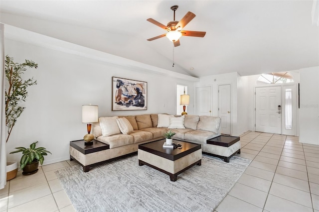11510 92nd Way, Largo, FL 33773 - living room with light tile patterned floors, vaulted ceiling, and a ceiling fan