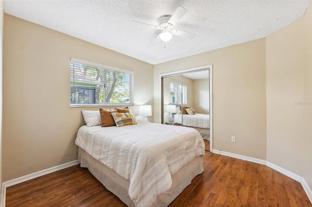 11510 92nd Way, Largo, FL 33773 - bedroom with baseboards, wood finished floors, a closet, a textured ceiling, and a ceiling fan